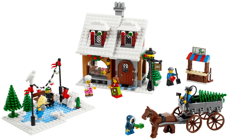 LEGO winter village set with a house, characters, and a horse-drawn carriage on a white background.