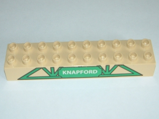Display of LEGO part no. 2291pb01 which is a Tan Duplo, Brick 2 x 10 with Green Lattice Pattern and Knapford Logo 
