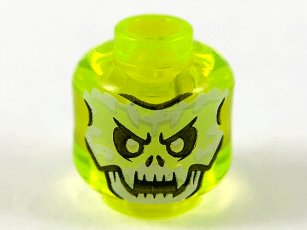 Display of LEGO part no. 28621pb0022 which is a Trans-Neon Green Minifigure, Head Alien Ghost with White and Yellowish Green Skull Face and Fangs Pattern, Vented Stud 