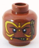 Display of LEGO part no. 3626bpb0573 which is a Reddish Brown Minifigure, Head PotC Cannibal Yellow Face Paint Pattern, Blocked Open Stud 