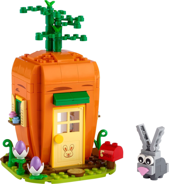 Toy carrot house with a rabbit figure on a white background