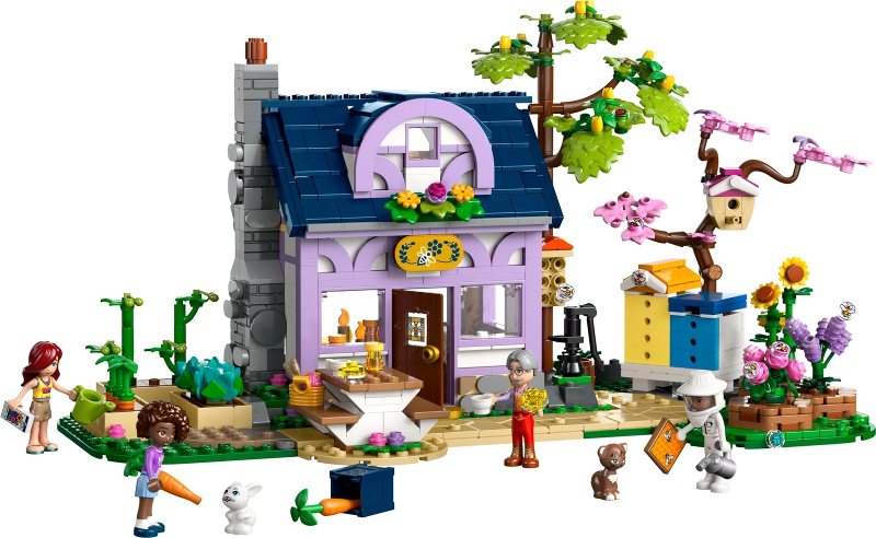 LEGO Friends set with a purple house, trees, and characters on a white background