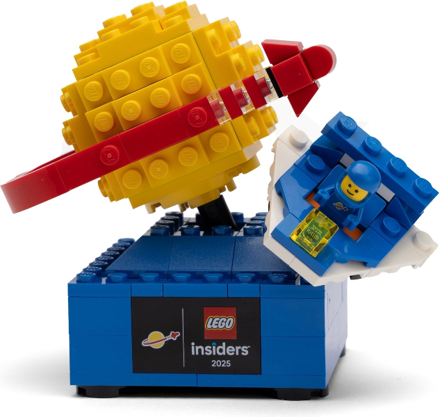 LEGO model with yellow hat, red bandana, and blue figure on a white background