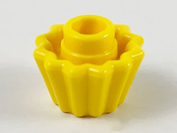 Display of LEGO part no. 65468d which is a Yellow Minifigure, Utensil Cupcake Liner, Indented Top 