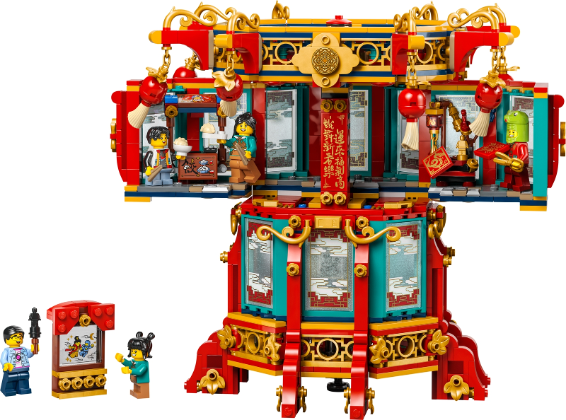 Colorful toy structure with intricate design and small figures on a white background