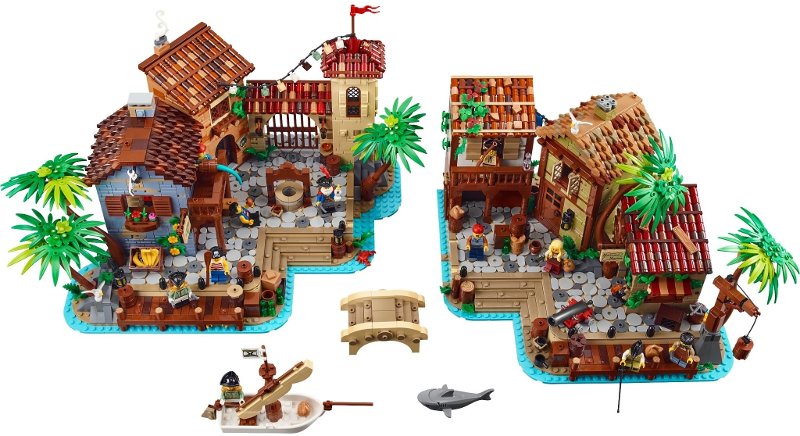 Toy pirate village set with various buildings and figures on a white background