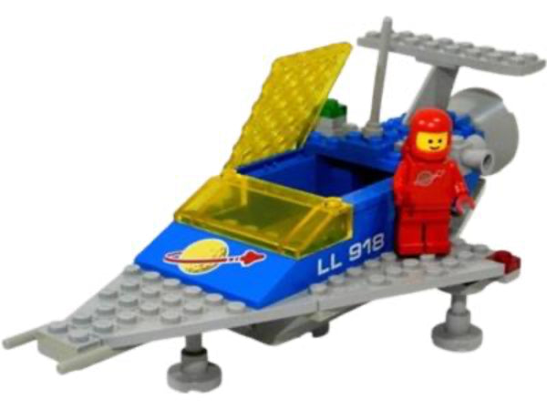 Toy space shuttle model with a red astronaut figure on a white background