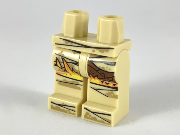 Display of LEGO part no. 970c00pb0974 which is a Tan Hips and Legs with Mummy Wrappings, Dark Dirt, Yellow and Orange Flames Pattern 