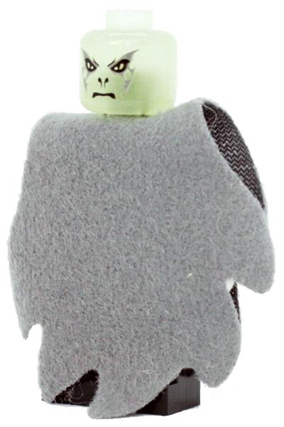 Toy figure of a creature with a green head and gray body on a white background