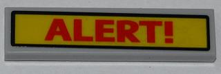 Display of LEGO part no. 2431pb281 Tile 1 x 4 with Red 'ALERT!' on Yellow Background Pattern (Sticker), Set 6860  which is a Light Bluish Gray Tile 1 x 4 with Red 'ALERT!' on Yellow Background Pattern (Sticker), Set 6860 
