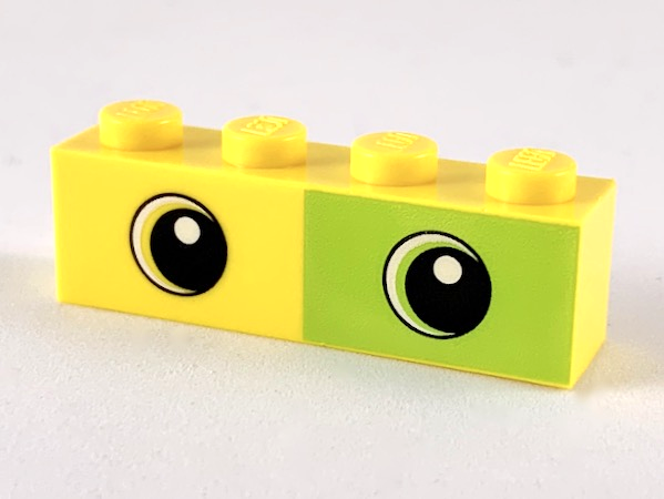 Display of LEGO part no. 3010pb267 Brick 1 x 4 with Lime Rectangle Half and Two Eyes Pattern  which is a Yellow Brick 1 x 4 with Lime Rectangle Half and Two Eyes Pattern 
