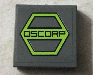 Display of LEGO part no. 3068bpb0936 Tile 2 x 2 with Groove with Black 'OSCORP' on Lime Hexagon Pattern (Sticker), Set 76016  which is a Dark Bluish Gray Tile 2 x 2 with Groove with Black 'OSCORP' on Lime Hexagon Pattern (Sticker), Set 76016 