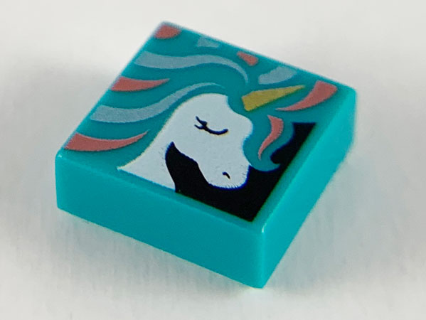 Display of LEGO part no. 3070bpb135 Tile 1 x 1 with Groove with White Unicorn Head, Gold Horn, and Metallic Light Blue and Coral Mane Pattern  which is a Dark Turquoise Tile 1 x 1 with Groove with White Unicorn Head, Gold Horn, and Metallic Light Blue and Coral Mane Pattern 