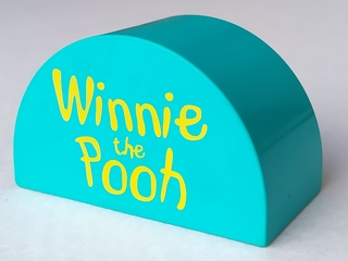 Display of LEGO part no. 31213px01 Duplo, Brick 2 x 4 x 2 Slope Curved Double with 'Winnie the Pooh' Pattern  which is a Light Turquoise Duplo, Brick 2 x 4 x 2 Slope Curved Double with 'Winnie the Pooh' Pattern 