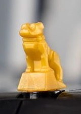 Display of LEGO part no. 35846 which is a Pearl Gold Dog, Bulldog &#40;Mack Truck Hood Ornament&#41; 