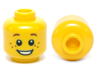 Display of LEGO part no. 3626cpb0471 Minifigure, Head Child Brown Eyebrows and Freckles, Open Smile, White Pupils Pattern, Hollow Stud  which is a Yellow Minifigure, Head Child Brown Eyebrows and Freckles, Open Smile, White Pupils Pattern, Hollow Stud 