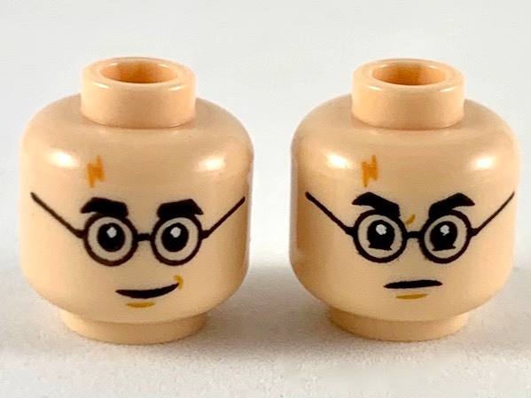 Display of LEGO part no. 3626cpb2413 Minifigure, Head Dual Sided Medium Nougat Lightning Scar, Black Eyebrows and Glasses, Smile / Angry Pattern, Hollow Stud  which is a Light Nougat Minifigure, Head Dual Sided Medium Nougat Lightning Scar, Black Eyebrows and Glasses, Smile / Angry Pattern, Hollow Stud 