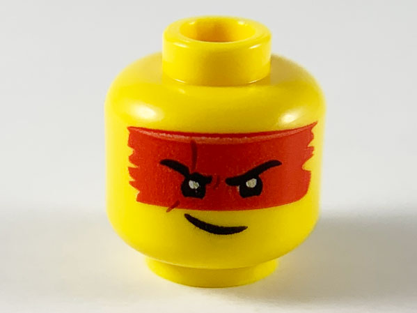 Display of LEGO part no. 3626cpb2554 Minifigure, Head Red Headband/Mask, Black Eyebrows with Scar on Right, Lopsided Grin Pattern, Hollow Stud  which is a Yellow Minifigure, Head Red Headband/Mask, Black Eyebrows with Scar on Right, Lopsided Grin Pattern, Hollow Stud 