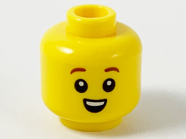 Display of LEGO part no. 3626cpb2597 Minifigure, Head Child Reddish Brown Eyebrows, Small Open Smile with Top Teeth Pattern, Hollow Stud  which is a Yellow Minifigure, Head Child Reddish Brown Eyebrows, Small Open Smile with Top Teeth Pattern, Hollow Stud 