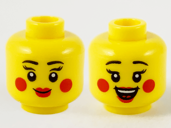 Display of LEGO part no. 3626cpb2745 Minifigure, Head Dual Sided Female Black Eyebrows, Red Lips and Circles on Cheeks, Closed Smile / Open Smile Pattern, Hollow Stud  which is a Yellow Minifigure, Head Dual Sided Female Black Eyebrows, Red Lips and Circles on Cheeks, Closed Smile / Open Smile Pattern, Hollow Stud 
