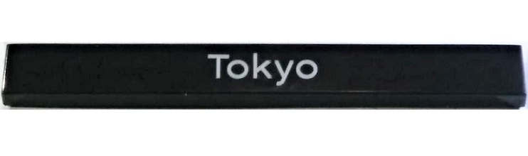 Display of LEGO part no. 4162pb214 Tile 1 x 8 with 'Tokyo' Pattern  which is a Black Tile 1 x 8 with 'Tokyo' Pattern 