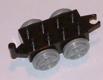 Display of LEGO part no. 4195c03 Duplo, Train Base 2 x 4 with Light Bluish Gray Wheels  which is a Black Duplo, Train Base 2 x 4 with Light Bluish Gray Wheels 