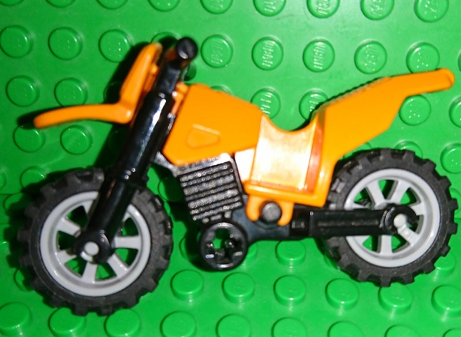 Display of LEGO part no. 50860c11 Motorcycle Dirt Bike with Black Chassis (Long Fairing Mounts) and Light Bluish Gray Wheels  which is a Orange Motorcycle Dirt Bike with Black Chassis (Long Fairing Mounts) and Light Bluish Gray Wheels 