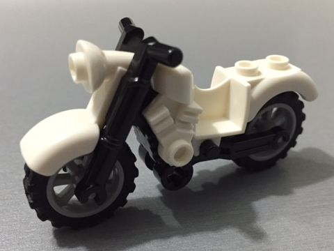 Display of LEGO part no. 85983c01 Motorcycle Vintage with Black Chassis and Light Bluish Gray Wheels  which is a White Motorcycle Vintage with Black Chassis and Light Bluish Gray Wheels 
