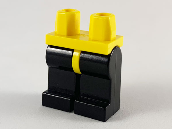 Display of LEGO part no. 970c11 Hips and Black Legs  which is a Yellow Hips and Black Legs 