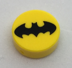 Display of LEGO part no. 98138pb065 Tile, Round 1 x 1 with Black Bat Batman Logo Pattern  which is a Yellow Tile, Round 1 x 1 with Black Bat Batman Logo Pattern 