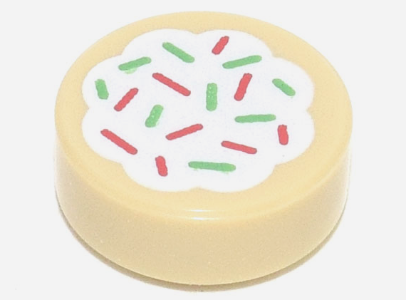 Display of LEGO part no. 98138pb256 which is a Tan Tile, Round 1 x 1 with Cookie with White Frosting and Red and Green Sprinkles Pattern 